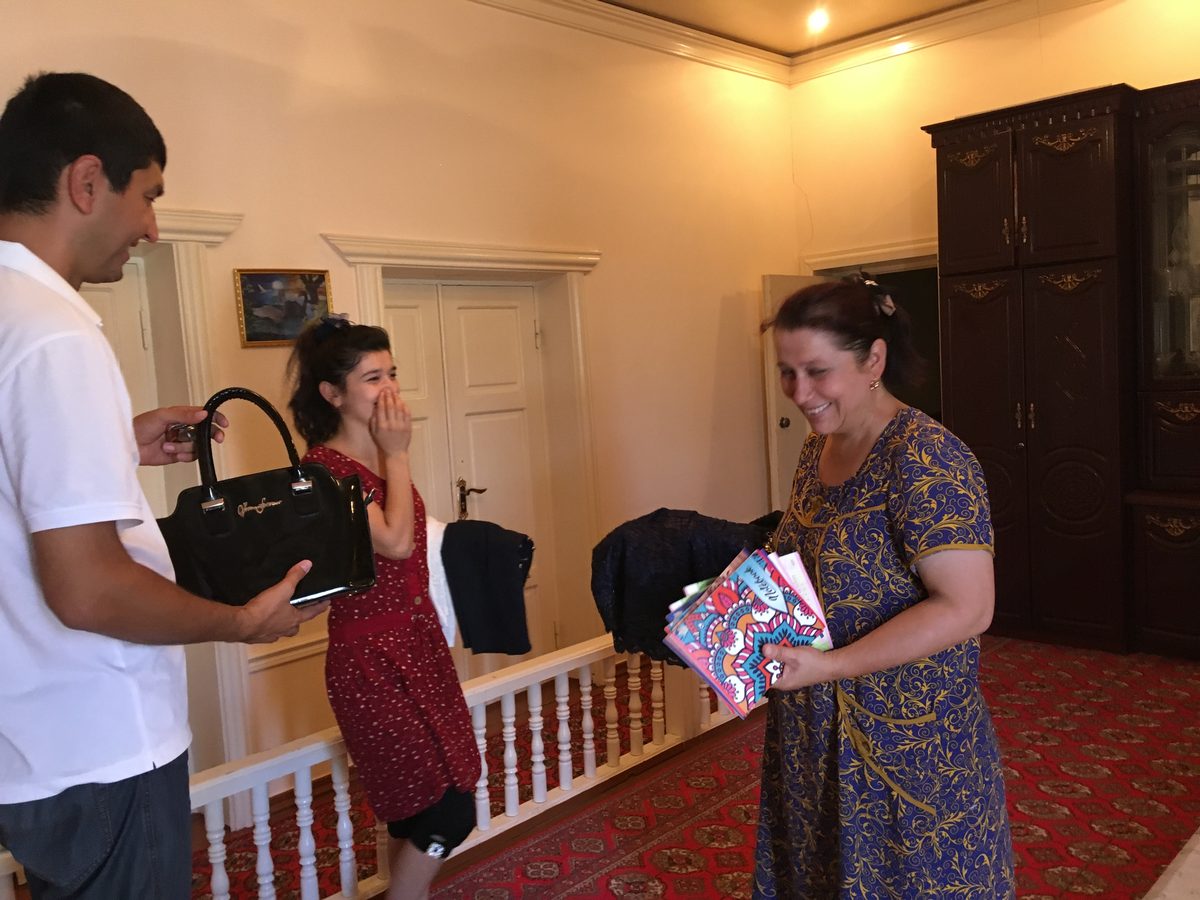 Family in Khiva receiving gifts and clothing